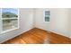 Cozy bedroom with hardwood floors and a view of the neighborhood at 9486 E 107Th Ave, Commerce City, CO 80640