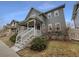 Charming two-story home features a welcoming front porch, complemented by well-maintained landscaping at 9486 E 107Th Ave, Commerce City, CO 80640