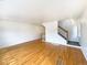 Bright living room featuring hardwood floors and staircase at 9486 E 107Th Ave, Commerce City, CO 80640