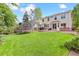 Well-maintained backyard with a trampoline and a spacious lawn, ideal for Gathering activities and relaxation at 1441 Cherry Pl, Erie, CO 80516