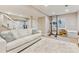Finished basement featuring a comfortable seating area and natural light through the garden level window at 1441 Cherry Pl, Erie, CO 80516