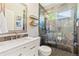 Updated bathroom with walk-in glass shower, modern vanity, and neutral colors creates a bright and relaxing space at 1441 Cherry Pl, Erie, CO 80516