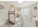bedroom with a charming bunk bed with unique wooden frame detail, plush carpet, and natural light at 1441 Cherry Pl, Erie, CO 80516