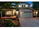 Charming two-story home featuring a large front-facing two car garage and brick accents at 1441 Cherry Pl, Erie, CO 80516