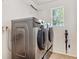 Laundry room features a modern washer and dryer at 1441 Cherry Pl, Erie, CO 80516
