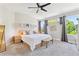 Bright bedroom with a ceiling fan and a large sunny window at 1441 Cherry Pl, Erie, CO 80516