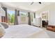 Sunlit bedroom with large sunny windows, a ceiling fan and modern decor at 1441 Cherry Pl, Erie, CO 80516