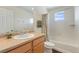 Clean bathroom featuring modern sink with tub and shower with neutral decor at 18800 E 55Th Ave, Denver, CO 80249