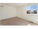 Neutral bedroom featuring a large window offering plenty of natural light at 18800 E 55Th Ave, Denver, CO 80249