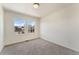 Bright bedroom with carpet, white walls and natural light from the double window at 18800 E 55Th Ave, Denver, CO 80249