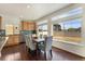 Bright dining area with natural light, hardwood floors, and modern finishes at 18800 E 55Th Ave, Denver, CO 80249