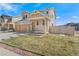 Inviting two-story home features a charming entrance, two car garage, and neutral siding in a Gathering-friendly neighborhood at 18800 E 55Th Ave, Denver, CO 80249