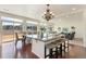 Bright, open-concept kitchen features a large island, granite countertops, and hardwood floors at 18800 E 55Th Ave, Denver, CO 80249