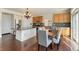 Modern kitchen features granite countertops, stainless steel appliances, and a dining area, perfect for everyday living at 18800 E 55Th Ave, Denver, CO 80249