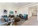 Cozy living room featuring neutral tones, stylish decor, and comfortable seating creates an inviting gathering space at 18800 E 55Th Ave, Denver, CO 80249