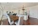 Open-concept layout with a kitchen island, dining area, and inviting living room is great for gatherings at 18800 E 55Th Ave, Denver, CO 80249