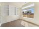 Home office with built-in shelving, natural light, and ample space provides a productive and comfortable workspace at 18800 E 55Th Ave, Denver, CO 80249