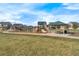 Neighborhood playground with a slide, picnic shelter, walking path, and green space for recreation at 18800 E 55Th Ave, Denver, CO 80249