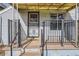 Inviting front porch with decorative railings and a sunny yellow awning, creating a cozy entrance at 339 Delaware St, Denver, CO 80223