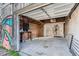 Open garage door revealing brick walls and a makeshift wooden table at 339 Delaware St, Denver, CO 80223