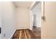 Hallway with hardwood floors connects the spaces, enhancing the home's open and flowing layout at 339 Delaware St, Denver, CO 80223