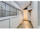 The hallway features large windows, patterned flooring, and white painted walls at 339 Delaware St, Denver, CO 80223