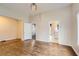 Open-concept living room with hardwood floors and a modern light fixture, perfect for entertaining at 339 Delaware St, Denver, CO 80223