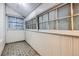 Bright sunroom features an interior design with floor to ceiling wood accents and views from every window at 339 Delaware St, Denver, CO 80223