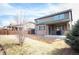 Large backyard with covered patio, shed, and ample space for outdoor activities at 25403 E 2Nd Ave, Aurora, CO 80018