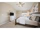 A serene bedroom boasts a cozy ambiance, enhanced by natural light and neutral color at 25403 E 2Nd Ave, Aurora, CO 80018