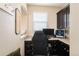 Home office featuring a built-in desk and cabinets for storage at 25403 E 2Nd Ave, Aurora, CO 80018