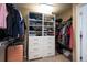 This walk-in closet offers an abundance of storage with custom shelving and hanging racks at 25403 E 2Nd Ave, Aurora, CO 80018