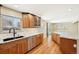 Kitchen features stainless appliances, granite countertops, and wood cabinets at 3293 S Florence Ct, Denver, CO 80231