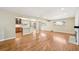 Bright, open-concept living room with hardwood floors and a view of the kitchen at 3293 S Florence Ct, Denver, CO 80231