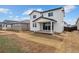 Charming backyard featuring a covered patio and freshly laid sod at 19120 E 96Th Pl, Commerce City, CO 80022