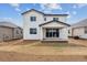 Charming backyard featuring a covered patio and freshly laid sod at 19120 E 96Th Pl, Commerce City, CO 80022