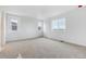 Bedroom featuring neutral carpet and three bright windows at 19120 E 96Th Pl, Commerce City, CO 80022