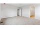 Spacious carpeted bedroom with doorway view to bathroom with glass shower door at 19120 E 96Th Pl, Commerce City, CO 80022