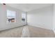 Cozy bedroom with two large windows offering natural light and neutral carpet at 19120 E 96Th Pl, Commerce City, CO 80022
