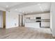 Spacious open-concept kitchen with stainless steel appliances, quartz countertops, and modern finishes at 19120 E 96Th Pl, Commerce City, CO 80022