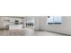 Spacious open-concept kitchen with stainless steel appliances, quartz countertops, and modern finishes at 19120 E 96Th Pl, Commerce City, CO 80022