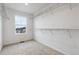 Walk-in closet featuring wire shelving and a bright window at 19120 E 96Th Pl, Commerce City, CO 80022