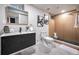 Modern bathroom with a wood-look shower, black vanity, and stylish mirror at 2380 Jasmine St, Denver, CO 80207