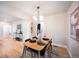 Well-lit dining area with modern light fixtures and a stylish table setup at 2380 Jasmine St, Denver, CO 80207