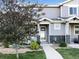 Charming home featuring a well-maintained lawn, walkway, and colorful landscaping at 6108 Kochia Ct # 104, Erie, CO 80516