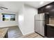 Kitchen area featuring stainless steel fridge and an open window with a view at 6108 Kochia Ct # 104, Erie, CO 80516
