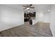 Spacious open living area featuring hardwood flooring, neutral paint, and ample natural light at 6108 Kochia Ct # 104, Erie, CO 80516