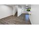 Inviting living room with stylish wood floors, staircase, and bright natural light at 6108 Kochia Ct # 104, Erie, CO 80516