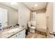 Well-maintained bathroom with granite countertop, tub-shower combo, and tile flooring offers functionality and style at 23201 E Orchard Pl, Aurora, CO 80015