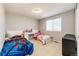 Bright bedroom with carpet, window, and two twin beds, offering a cozy and functional living space at 23201 E Orchard Pl, Aurora, CO 80015